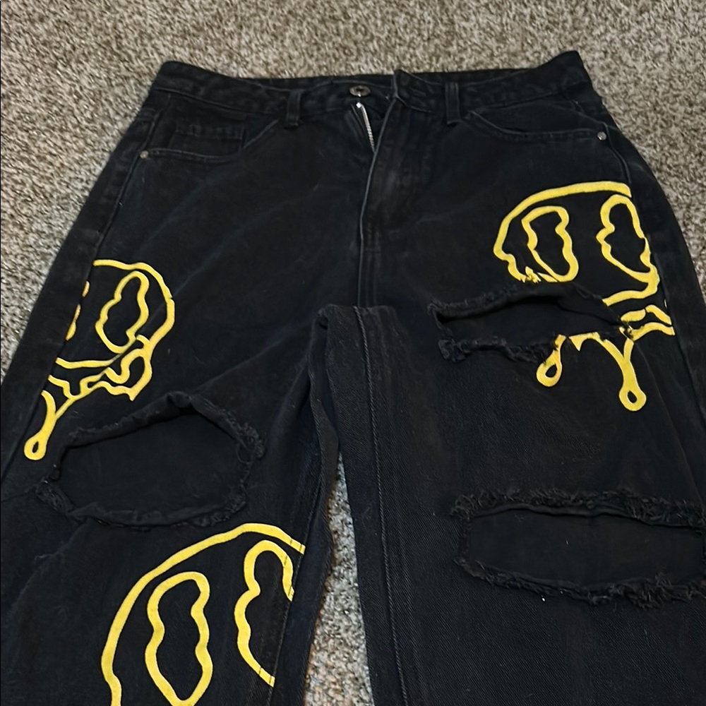 Black Jeans with Yellow Smiley Design